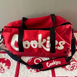 Cookies brand Red Duffle Bag with Shoulder Strap. Excellent condition.